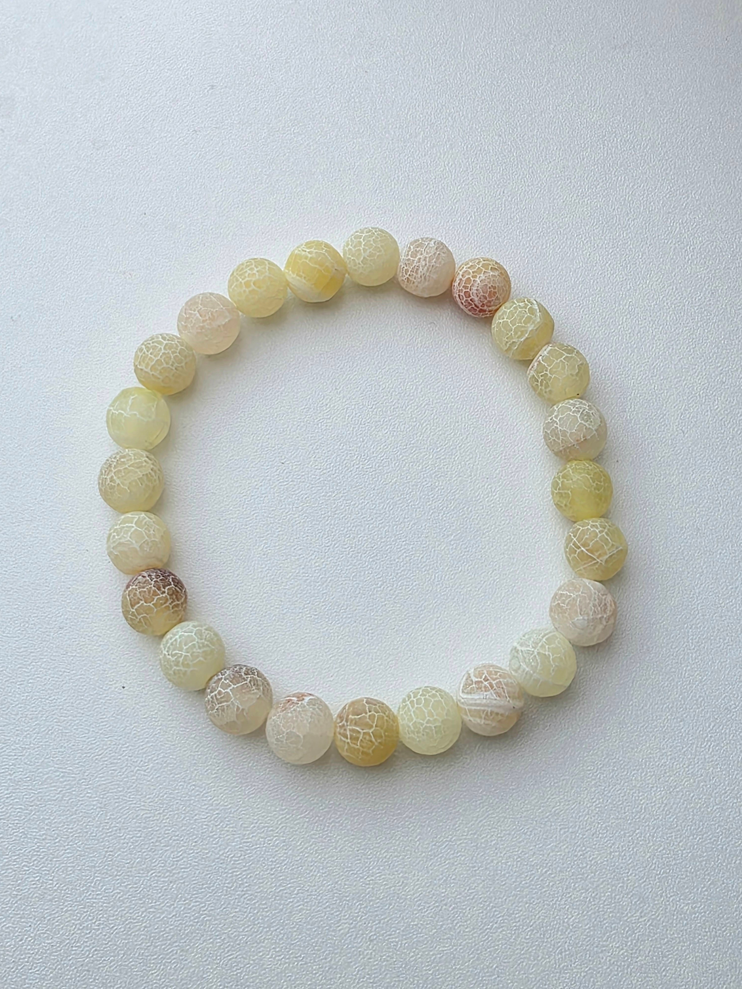 Bracelet en perles écaillées couleur jaune - la fabrique à pampilles