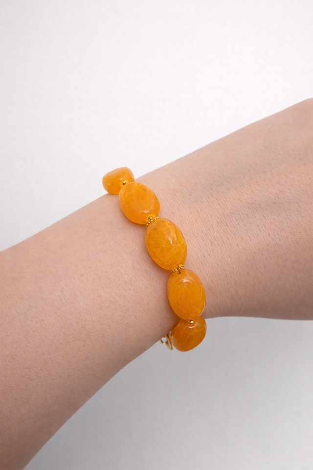 Bracelet en perles ovales couleur orange - la fabrique à pampilles