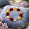 Bracelet en perles ovales couleur rouge et jaune- la fabrique à pampilles