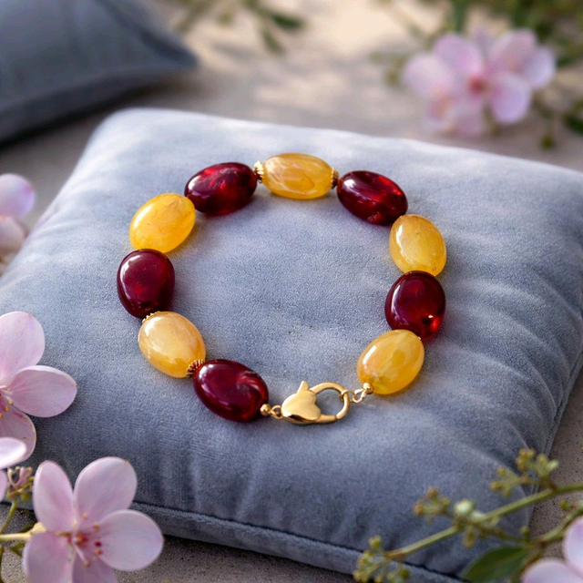 Bracelet en perles ovales couleur rouge et jaune- la fabrique à pampilles
