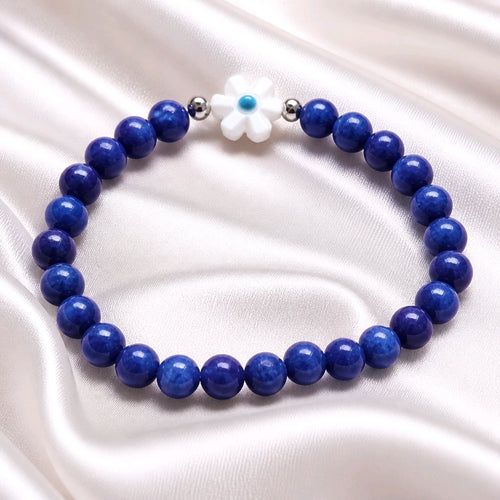 Bracelet élastique perles rondes bleu foncé avec fleur blanche