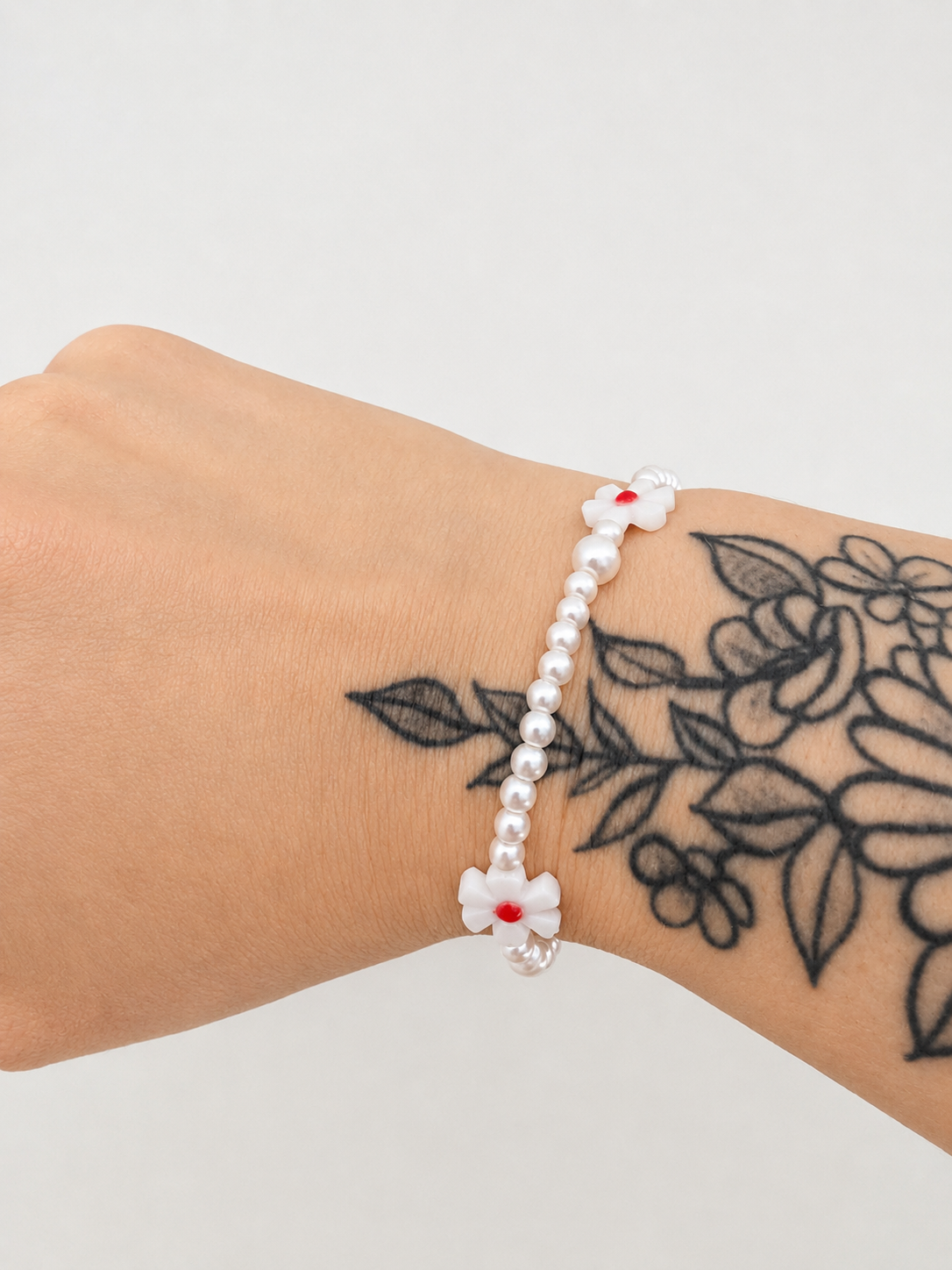 Bracelet perles et fleur coeur rouge