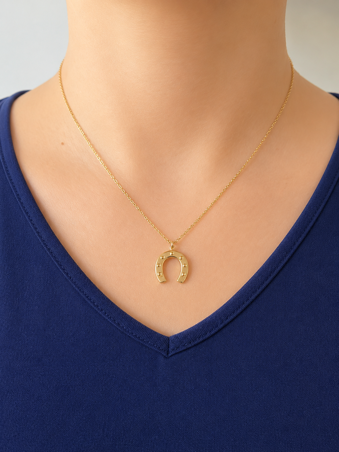 Collier fer à cheval doré