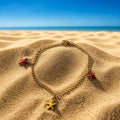 Bracelet doré étoiles de mer jaune/rouge