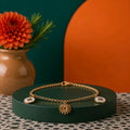 Bracelet doré a breloques tournesol-etoiles